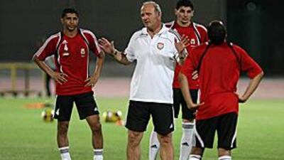 Dominique Bathenay watches over training at the Al Wasl club in Dubai before tonight's friendly with Germany.