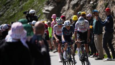 Slovenia's Tadej Pogacar, left, Denmark's Jonas Vingegaard, centre, and Spain's Juan Ayuso, right, climb the Col du Galibier. AP