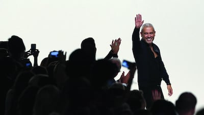 Elie Saab waves to the crowds at his spring/summer 2014 ready-to-wear collection fashion show at Paris Fashion Week earlier this week. He has found time to work with Evian between his popular fashion endeavours. AFP Photo / Francois Guillot