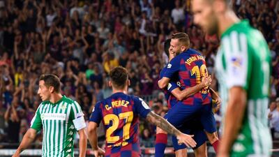Barcelona's Spanish defender Jordi Alba celebrates with teammates after scoring against Betis. AFP