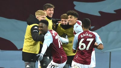 Villa's players celebrate Louie Barry's goal. AP