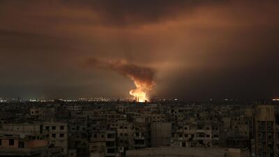 Smoke billows following a regime air strike on the besieged Eastern Ghouta region AFP