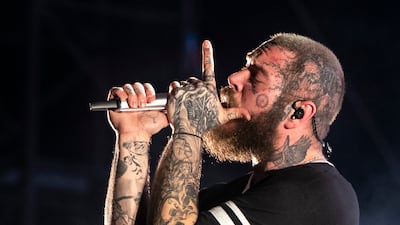 Post Malone performs in front of a large crowd at Etihad Park, Yas Island, Abu Dhabi. All photos: Ruel Pableo for The National