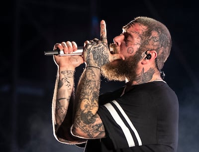 Post Malone performing in front of a large crowd at Etihad Park, Yas Island, Abu Dhabi. Ruel Pableo for The National