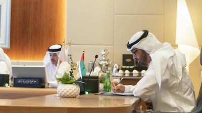 Sheikh Mohamed bin Zayed, Crown Prince of Abu Dhabi and Deputy Supreme Commander of the UAE Armed Forces (right) chairs a Supreme Petroleum Council meeting at Adnoc headquarters. He is seen with Sheikh Hazza bin Zayed, Vice Chairman of the Abu Dhabi Executive Council (left). Mohamed Al Hammadi / Ministry of Presidential Affairs