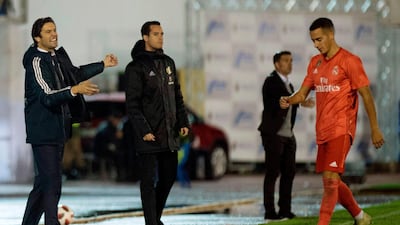 Real Madrid's Argentinian coach Santiago Solari gestures as Spanish midfielder Lucas Vazquez walks past during the Spanish King's Cup football match against UD Melilla. AFP