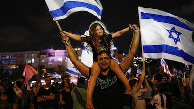 People celebrate after Israel's parliament voted in a new coalition government, ending Benjamin Netanyahu's 12-year hold on power, at Rabin Square in Tel Aviv, Israel. Reuters