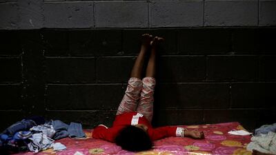 A girl who was evacuated along her family from their home is pictured at a sports centre being used as a shelter as Hurricane Eta approaches in Tela, Honduras. Reuters