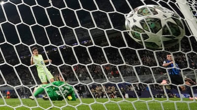 Inter Milan's Lautaro Martinez, right, celebrates after scoring his side's opening goal. AP