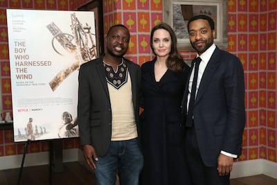 William Kamkwamba with Hollywood star Angelina Jolie and director Chiwetel Ejiofor at a special screening of The Boy Who Harnessed The Wind in New York in 2019. AFP