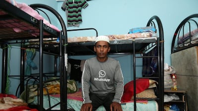 Abdul Kalam, from Bangladesh, survived last Saturday’s bus crash in which 13 of his colleagues died. He is pictured at his labour camp in Umm Al Quwain. Pawan Singh / The National