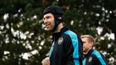 Arsenal keeper Petr Cech arrives to training on Tuesday with teammates ahead of their Wednesday Champions League match in Munich. Dan Mullan / Getty Images
