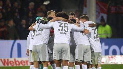 Bayern's players celebrate after winning the Bundesliga match against Freiburg. EPA
