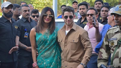 Chopra was wearing a beautiful green saree, and chooda bangles - which a newlywed woman traditionally wears for several weeks after her wedding ceremony. Around her neck, Chopra wore a traditional mangalsutra necklace - with black and gold beads, another marker of a newlywed. Jonas, meanwhile, opted for a monochrome khaki suit - perhaps hinting that their honeymoon will be a safari? Photo: Reuters