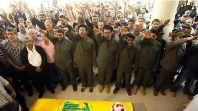 Hizbollah members support relatives of Saleh Ahmed Sabagh during his funeral in the port-city of Sidon, southern Lebanon.