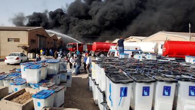 Smoke rises from a storage site in Baghdad, housing ballot boxes from Iraq's May parliamentary election, Iraq on June 10, 2018. Khalid al-Mousily / Reuters
