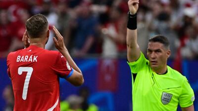 Romanian referee Istvan Kovacs gives a red card to Czech Republic midfielder Antonin Barak. AFP