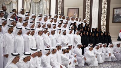 Dr Ahmed Mubarak Al Mazrouei, Secretary General of the Abu Dhabi Executive Council (second row 5th left), Humaid bin Saeed Al Neyadi, Deputy Director of the Office of the UAE Minister of Presidential Affairs (second row 6th left), Hamad Abdul Rahman Al Madfa, Secretary General of the Supreme Council of the Union Affairs in the Ministry of Presidential Affairs (second row 7th left), Ahmed Mohamed Al Humairi, the Secretary-General of the Ministry of Presidential Affairs (second row 8th left), Ahmed Juma Al Zaabi, UAE Deputy Minister of Presidential Affairs (second row 9th left), Sheikh Tahnoon bin Mohamed Al Nahyan, Ruler's Representative in Al Ain Region (second row 10th left), Sheikh Mohamed bin Zayed, Crown Prince of Abu Dhabi and Deputy Supreme Commander of the UAE Armed Forces (second row 11th left) and Sheikh Mansour bin Zayed, UAE Deputy Prime Minister and Minister of Presidential Affairs (second row 12th left), stand for a photograph with members of Ministry of Presidential Affairs, during an iftar reception at Abu Dhabi's Al Bateen Palace.