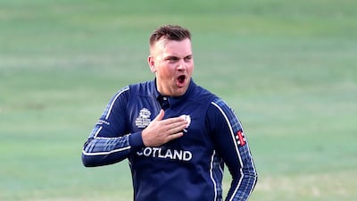 Scotland bowler Mark Watt celebrates after taking the wicket of UAE's Rameez Shahzad. Chris Whiteoak / The National