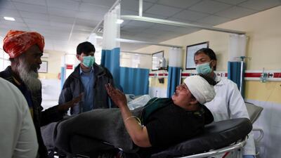 An Afghan Sikh woman wounded in a gunmen attack is brought to a hospital in Kabul, Afghanistan. AP Photo