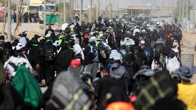 During the walk, pilgrims are met by volunteers who have set up tents along the roads to distribute free food and drinks and offer places for them to rest. EPA
