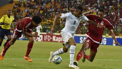 Equatorial Guinea’s defender Rui (R) vies with Ghana’s forward Jordan Ayew (C) during the 2015 African Cup of Nations semi-final football match between Equatorial Guinea and Ghana in Malabo, on February 5, 2015. AFP PHOTO / ISSOUF SANOGO