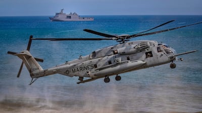 A US Marine helicopter takes off during a joint amphibious assault exercise with the Philippines off the waters of South China Sea. Getty Images