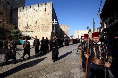 A procession of Roman Catholic clergymen on Maundy Thursday outside the Church of the Holy Sepulchre in Jerusalem's Old City. Gali Tibbon / AFP