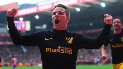 Atletico Madrid's French forward Kevin Gameiro celebrates after scoring a goal during the Spanish league football against Sporting Gijon at El Molinon Stadium in Gijon on February 18, 2017. Miguel Riopa / AFP