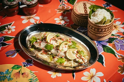 Steamy sea bass with spicy lime-garlic dressing, Thai celery and cabbage. Photo: Sip Song