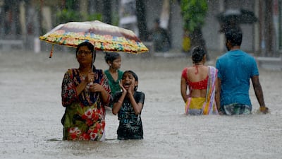 Heavy rain brought India's financial capital Mumbai to a virtual standstill last week, flooding streets, causing transport chaos and prompting warnings to stay indoors. Punit Paranjpe / AFP