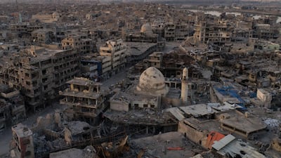 Aerial view of destroyed building and shops in the Old City of Mosul where traders are trying to revive their business on self-help basis. Felipe Dana / AP.