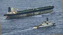 A US Coast Guard vessel escorts the Marinera tanker. Its seizure could be part of a growing move against the global shadow fleet. AFP