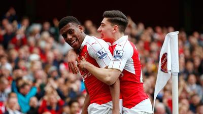 Alex Iwobi, left, celebrates after scoring against Watford. Julian Finney / Getty Images