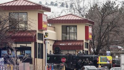 Police used armored vehicles to smash windows and walls to gain access as a gunman opened fire at a King Sooper's grocery store. AFP