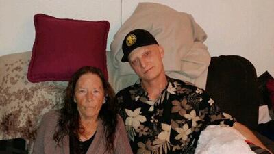 In this 2018 photograph released by lawyer Mark Zaid, Michael R. White, right, is seen with his mother, Joanne White, left. White, a U.S. Navy veteran from California, has been sentenced to 10 years in prison in Iran, his lawyer said Saturday. AP