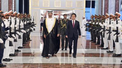 Japanese PM Shinzo Abe (centre right) walks with Dr Sultan Al Jaber, Minister of State, Director-General and CEO of ADNOC Group, the Chairman of Masdar, Chairman of the UAE National Media Council and the Chairman of Abu Dhabi Ports (centre left), upon his arrival to visit Abu Dhabi on the first leg of his Middle East tour. EPA