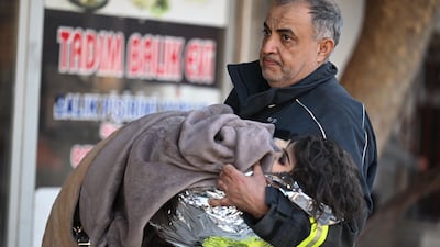 The family was pulled from the rubble beneath what used to be their house