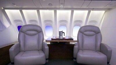 The 747-8 Intercontinental's cabin, featuring larger windows and new lighting, is displayed in a mock up of seats and a table February 12, 2011 at the Boeing Customer Experience Center in Renton, Washington. The new plane, which will be unveiled February 13, 2011, features quieter more fuel efficient engines, more passenger seating and redesigned interiors. Stephen Brashear/Getty Images/AFP