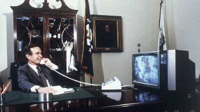 1981: U.S. Vice President George H. Bush speaks with space shuttle astronauts. AP Photo