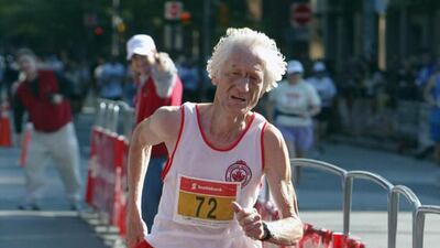 Seventy-two year old Ed Whitlock of Toronto finishes in a world record for his age class 2:59:09 in the Toronto Waterfront Marathon in Toronto on Sunday September 28, 2003. Frank Gunn / AP Photo