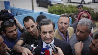 Fawaz Al Itan, the Jordanian ambassador in Libya, centre, speaking to the press upon his arrival at Marka Military Airport, in Amman, Jordan on May 13, 2014. The ambassador was released by his captors after his abduction in Tripoli last month. Mohammad Hannon/AP Photo