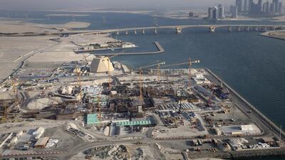 This view shows the entire Louvre Abu Dhabi construction site with a backdrop of the Sheikh Khalifa Bridge and Reem Island. Silvia Razgova / The National