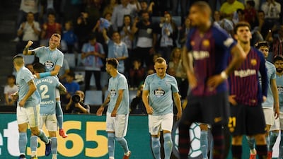 Iago Aspas, left, celebrates after scoring Celta Vigo's second goal in the 2-0 win over Barcelona. Getty Images