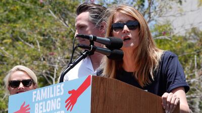 American actress Laura Dern, right, addresses protesters as she introduces California Lieutenant Governor Gavin Newson, centre, at a demonstration against the immigration policies of US president Donald Trump in Los Angeles, California. EPA