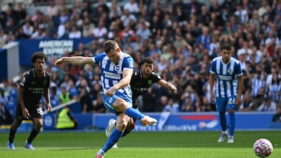 Former Manchester City player James Milner scores from the spot to level for Brighton. Reuters
