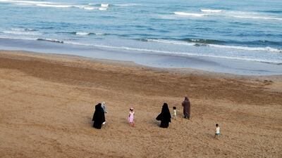 In this photo taken on August 12, 2016, Moroccan women wearing the niqab walk along the beach in Casablanca with their children. Emily Irving-Swift/AFP