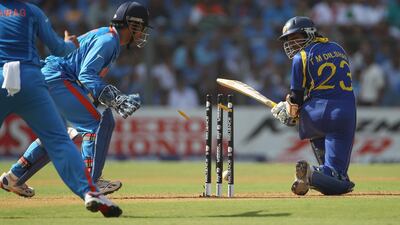 Tillakaratne Dilshan is bowled in the World Cup final against India. Getty Images