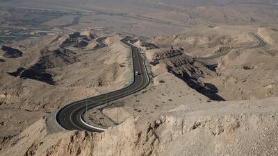 Cars climb up the windy road up toward the Jebel Hafeet. Silvia Razgova / The National