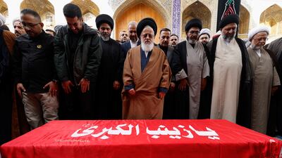 Prayers over the coffin of senior IRGC adviser Brig Gen Razi Mousavi in Iraq before his body is returned to Iran. Reuters